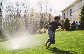 Child playing in yard